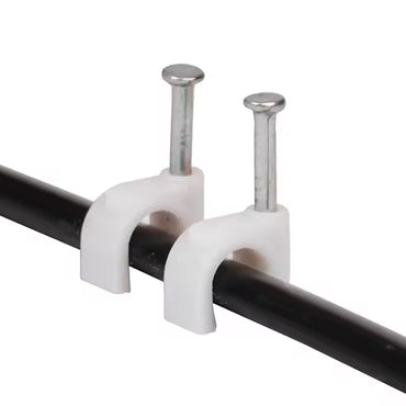 Close-up of plastic U-shaped 8mm nail cable clips with steel nails