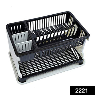 Multi-level kitchen dish rack organizing plates, cups, and cutlery.