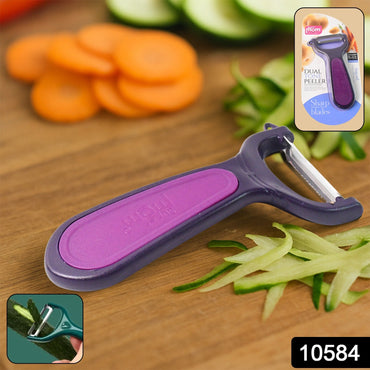 Close-up of vegetable peeler showing sharp metal blade and stylish dual tone handle