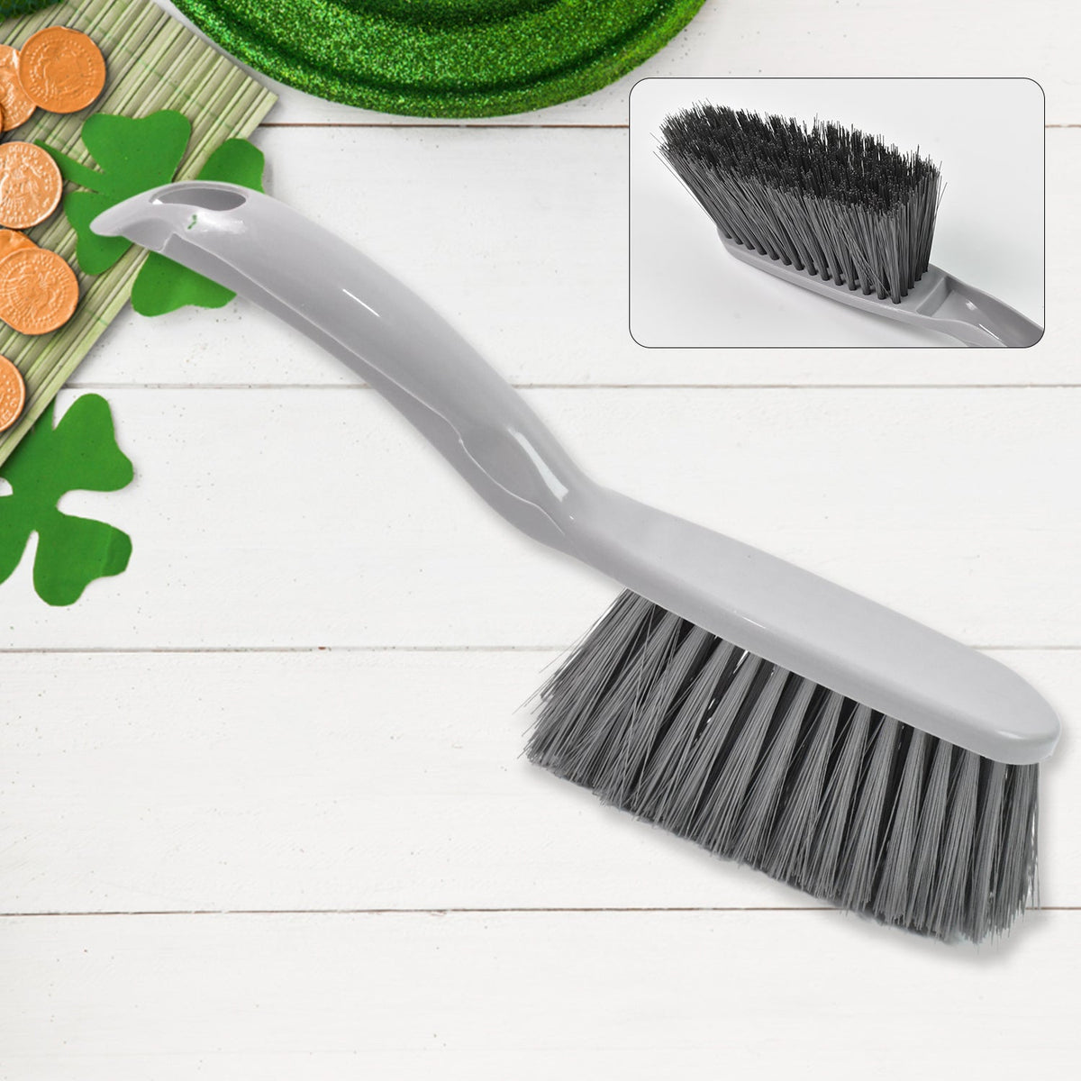 Detail view of the ergonomic long-handle brush from the cleaning kit.