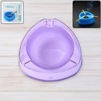 Transparent purple plastic ashtray with wide bowl and triangular shape