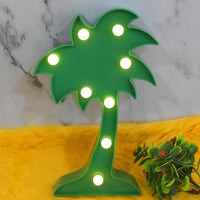 The Coconut Tree LED Lamp placed on a table, creating a romantic atmosphere in a home setting.
