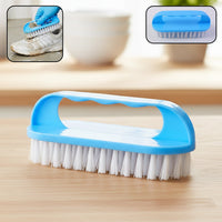 Handheld cleaning scrub brush with ergonomic handle and strong bristles for heavy-duty use.