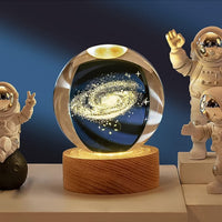 Close-up of 3D Crystal Ball Lamp showing detailed engraving and sturdy wooden base.