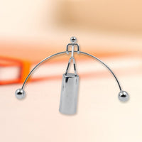 Elegant metal balance desk toy, a classic physics demonstration piece.