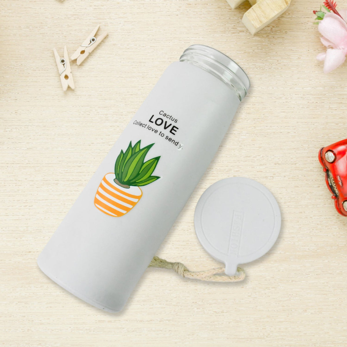 Close-up of the eco-friendly borosilicate glass water bottle, highlighting its clear material and stylish design.