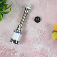 Person washing vegetables under the adjustable, water-saving faucet sprinkler.