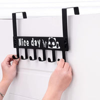 Black over door rack with six hooks for coats and towels hanging