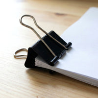 Sturdy office binder clips with rust-resistant black coating