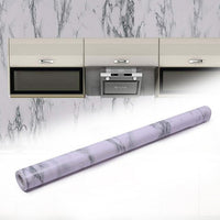 Roll of marble kitchen wallpaper with realistic white and grey pattern