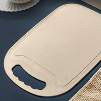 Kitchen plastic chopping board showing smooth surface and handle