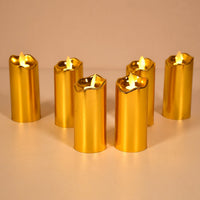 Three elegant golden LED candles creating a warm glow for home decor.