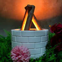 Airvanta bonfire effect diffuser creating a serene atmosphere on a wooden table.