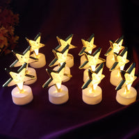 Set of star shaped flameless LED candles with golden outlines for elegant home décor