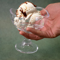 Close-up of a stylish footed glass dessert bowl from the set.