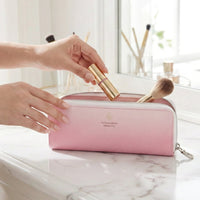 Makeup brush pouch filled with cosmetic tools inside