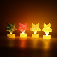 Star LED Tealight Candles used as table centerpieces, adding a magical touch to any celebration.
