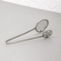Polished steel serving tong with dual mesh and perforated sides for draining food