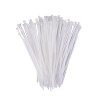A hand holding flexible black self-locking cable ties, demonstrating their durability.