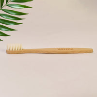 Ergonomic wooden handle of MintGuard bamboo toothbrush for comfortable grip