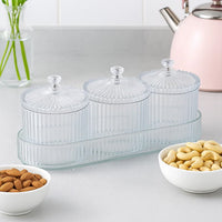 Elegant set of dry fruit storage jars neatly arranged on matching tray
