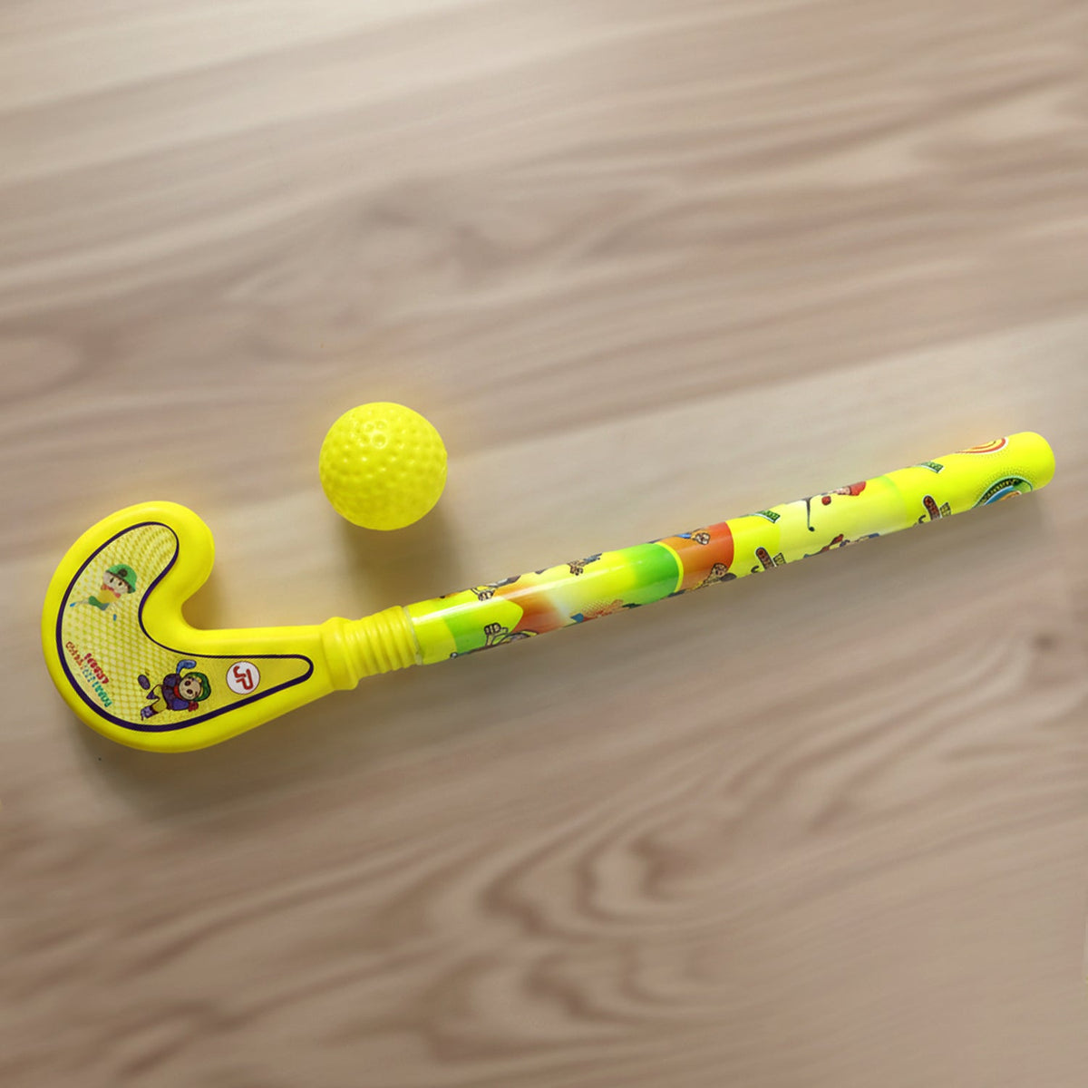 Overhead view of the complete plastic cricket and hockey sports set for active kids.