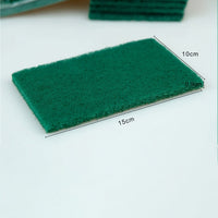 Detail view of the non-woven material of the aqua green scrub pads.