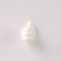 White hand wall clip neatly holding a set of keys