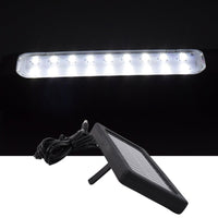 Eco shine mode lit on outdoor hanging solar LED light in garden setting