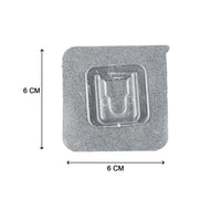 Multiple self-adhesive transparent hooks neatly organized on a surface.