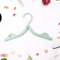Camping with foldable travel hangers holding clothes securely