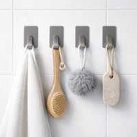 Close-up showing adhesive backing of wall hooks