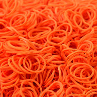 Orange elastic rubber bands closeup showing texture