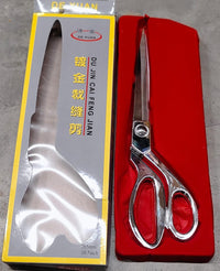 Top-down view of Cisora's gold-plated cloth cutting scissors, highlighting precision.