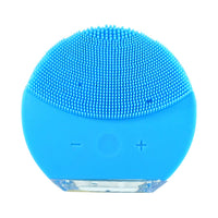 Facial cleansing brush glowing to show sonic technology in use