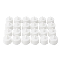 Multiple battery-operated tealights illuminating a dark room.