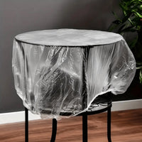 Heavy-duty plastic sofa cover protecting a large couch from dust and spills.