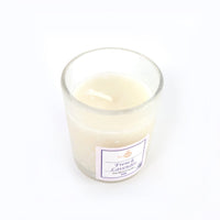 Top view of French Lavender soy candle glowing with warm flame