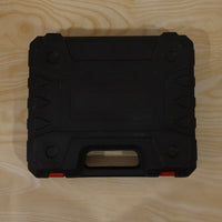Cordless drill tool kit case on wood surface