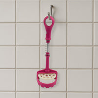 Easy-to-clean food-grade potato masher under running water.