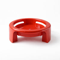 Matka Stand supporting a plant pot in a home setting, illustrating its versatile use.