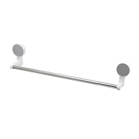 Wall-mounted adhesive towel rod holding towels in bathroom setting