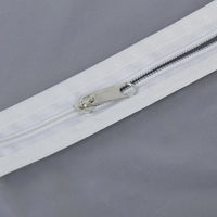 Closeup of durable full-length zipper on the breathable fabric suit cover.