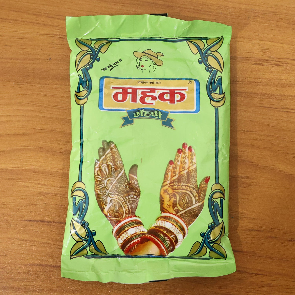 Hand displaying vibrant dried henna design after Herbal Mehndi Powder application