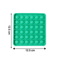 Close-up of popping bubbles on silicone Pop It toy