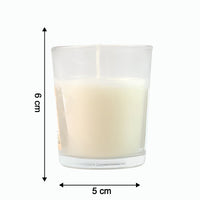 Close-up of a lit Blueberry Scented Votive Candle, showing the gentle flame.