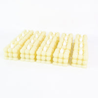 Decorative table setting illuminated by warm LED flameless cube candles