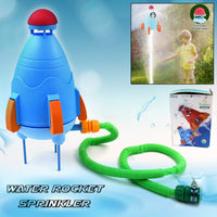 Children laughing while being sprayed by the rocket water sprinkler.