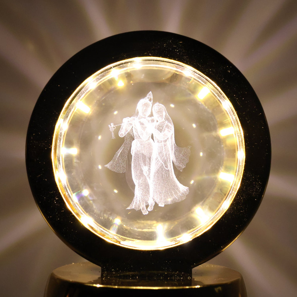 Golden base Radhe Krishna decorative lamp emitting soft ambient LED light
