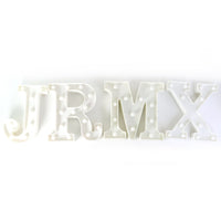 Mix design LED night lamp illuminating bedroom shelf softly